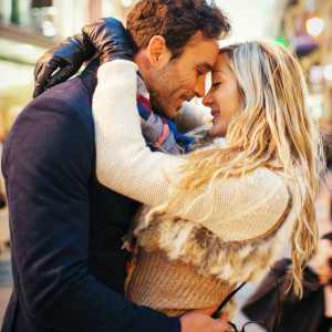 Lovely Spanish couple embracing on Madrid street