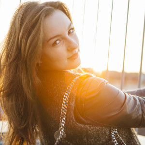 modern young woman portrait in urban scene with back lit