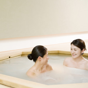 Two women taking bath together