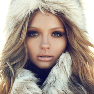 Beauty Fashion Model Girl in a Fur Hat. Winter Woman