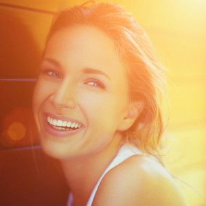 Beauty portrait of a young blonde woman with beautiful smile