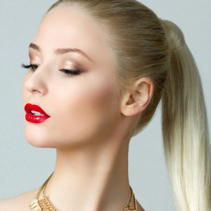 Beauty portrait of gorgeous blonde woman with ponytail