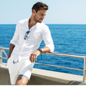 handsome-man-wearing-white-clothes-posing-in-sea-scenery-picture-id537548268