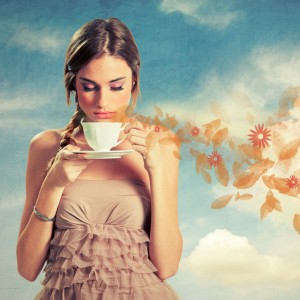beautiful-young-woman-holding-a-cup-of-tea-picture-id164207682