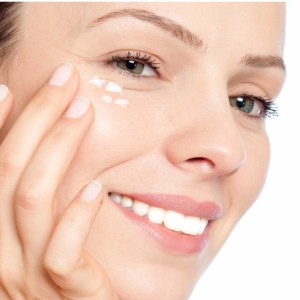 skin-care-woman-putting-face-cream-picture-id465525193